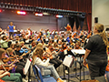Students of all grade levels practice their orchestra sets ahead of a concert